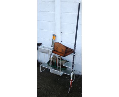 An assortment of garden related items and tools. Including a metal and glass plant stand, a weeder, etc.