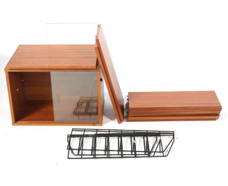 Two mid-century Ladderax type shelf units. Including four various black metal painted side pieces, a glass front display cupb