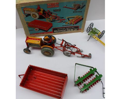 A Mettoy Playthings Modern farming Mechanical Tractor set boxed together with a Mamod steam engine