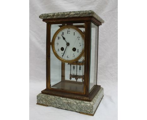 A French marble and brass four glass mantle clock, with a rectangular moulded top, the circular dial with Roman numerals, str