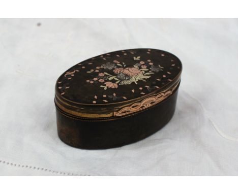 A 19th century inlaid horn snuff box, of oval form decorated with white and yellow metal flowers and leaves 7.5cm wide x 4.5c