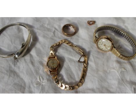 A lady's 18ct yellow gold wristwatch, on a rolled gold bracelet together with a 9ct gold watch, bangle, dress ring etc
