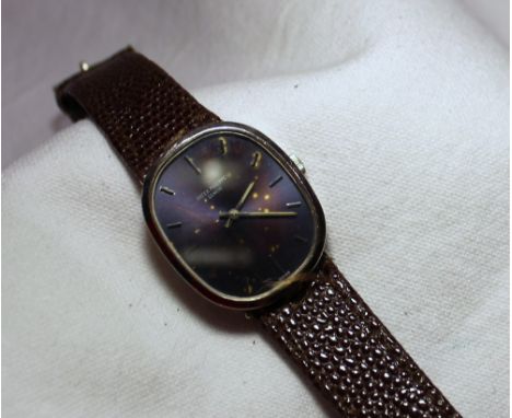 A Patek Philippe Geneve Ellipse Gentleman's wristwatch oval blue dial with applied baton indexes manual winding, to a brown l