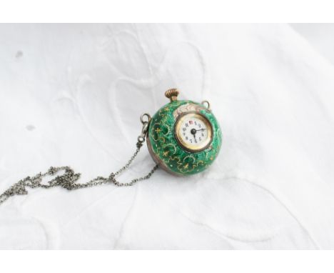 A silver and green enamel decorated pendant ball watch, with an enamelled dial with Arabic numerals on a white metal chain
