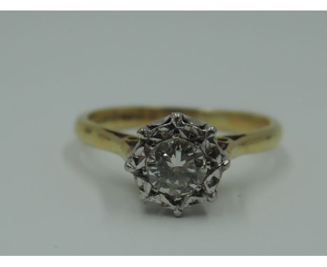 A diamond solitaire dress ring, approx 0.5ct in an illusionary setting to knife blade shoulders on an 18ct gold loop, size M 