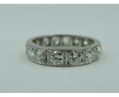 A diamond set full eternity ring having 16 old cut diamonds, total approx 1ct in a white metal loop, no marks, previously tes