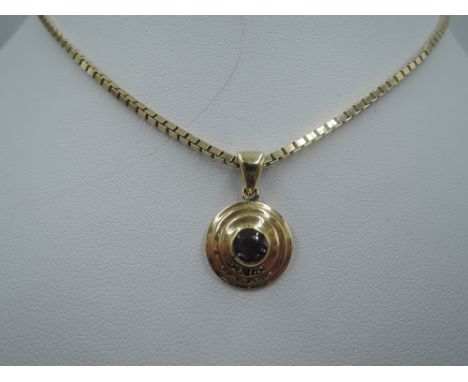 A yellow metal and amethyst circular pendant on a 9ct gold box chain, approx 18' &amp; 12g
chain approx 9.7g &amp; 17", clasp