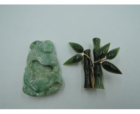 A carved jadeite style pendant and a jade style brooch modelled as bamboo