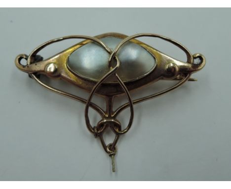 A 9ct rose gold Art Nouveau brooch by Barnet Henry Joseph having wirework detail with mother of pearl panel and drop (loose)