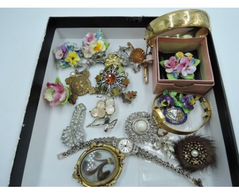 A small selection of costume jewellery including ceramic brooches and earrings, rolled gold bangle, wrist watches, etc