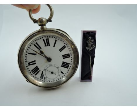 A Continental silver key wound pocket watch having oversized Roman numeral dial with subsidiary seconds in a case having engi