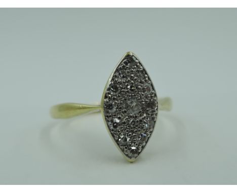 A diamond dress ring having a chip set lozenge panel to knife blade shoulders on a yellow metal loop stamped 18ct, size N &am