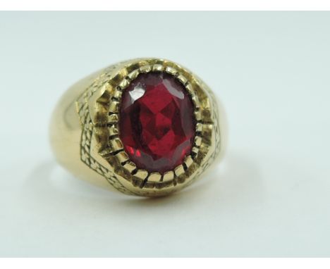 A yellow metal signet ring stamped 750 having an inset oval ruby, size I/J &amp; approx 3.7g
stone tests as a ruby but unable