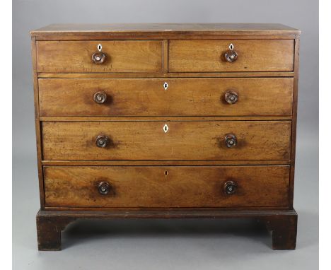 A 19th century mahogany chest fitted two short &amp; three long graduated drawers with turned knob handles, &amp; on bracket 