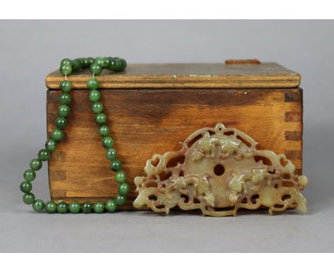 A Chinese carved jade pendant, 4¼” x 2¼”; &amp; a jade bead necklace, 16” long.