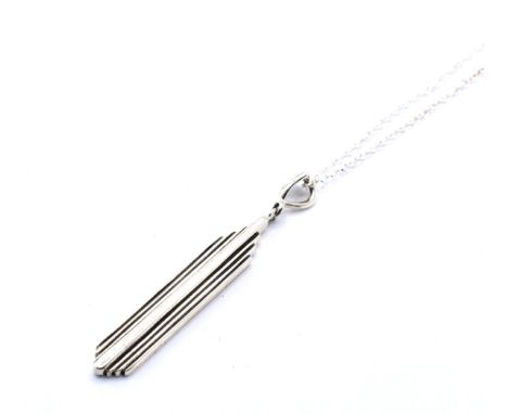 A sterling silver Art Deco style pendant upon a silver tracer chain. Chain measures approximately 44cm in length. Total weigh