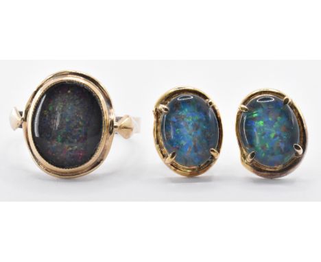 A 9ct gold ring bezel set with a central oval faux opal blue stone panel together with a pair of yellow metal and faux opal s