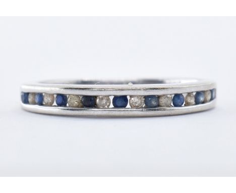 A stamped 9ct white gold half eternity ring set with sapphire and diamonds. Hallmarked for London Size I.5g. Total weight 1.7