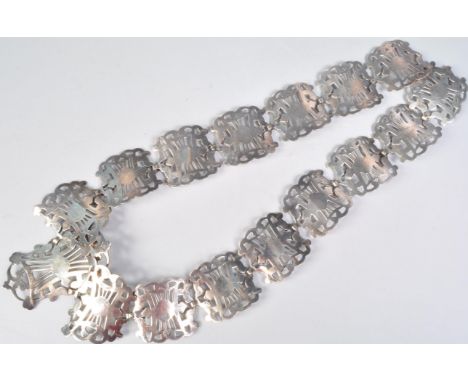 An Edwardian silver plated nurses belt having sixteen pierced Art Nouveau style links. Marked EPNS to the verso. Measures 69 
