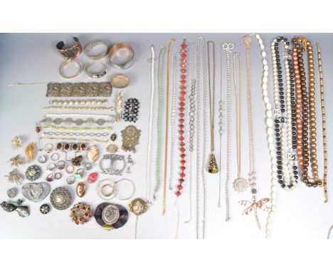 A collection of vintage costume jewellery to include printed portrait miniature items, a white metal panel bracelet, a black 