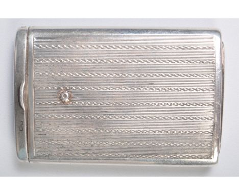 A silver hallmarked vesta case having an engine turned exterior with a sliding action and match strike to one end. Hallmarked