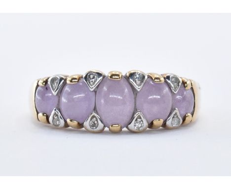 A stamped 9ct gold ring having a row of five amethyst cabochons having eight diamonds. Stamped 375 and hallmarked for Sheffie