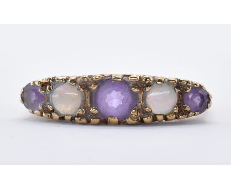 A 9ct gold five stone ring having a central round cut amethyst flanked by two opal cabochons and a further two purple stones.