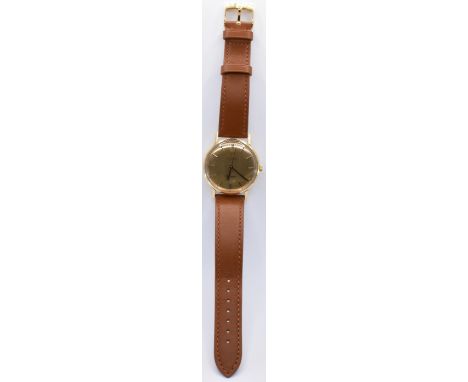 A vintage gentleman's Omega Seamaster De Ville 18ct gold cased wrist watch having a yellow brushed dial with gold baton marki