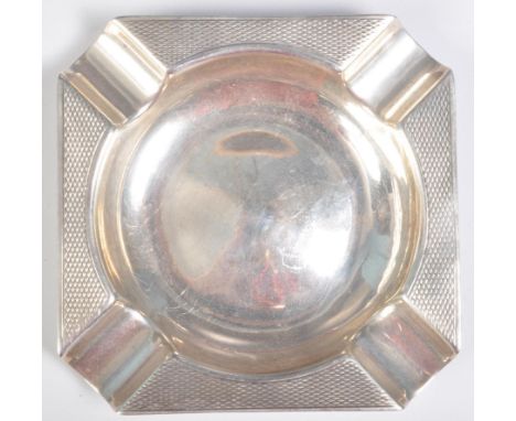 A 1920's Art Deco Cohen &amp; Charles silver hallmarked ash tray of square form having flared rims with engine turned decorat