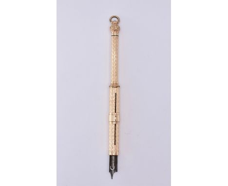 A 9ct gold propelling mechanical pencil having engine turned chevron decoration to the shaft and a bail atop. Tests as 9ct go