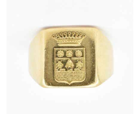 A French 18ct gold signet ring having a square head with engraved crest to the head. French owl mark to the band. Weight 14.0