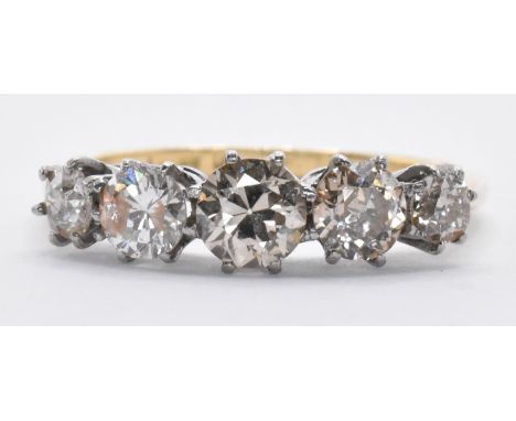 An 18ct gold and diamond five stone diamond ring being set with five graduating round cut diamonds. Diamonds estimated 1.3cts