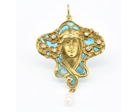 An 18ct gold Art Nouveau pendant in the form of a maiden within a whiplash design being set throughout with round cut diamond