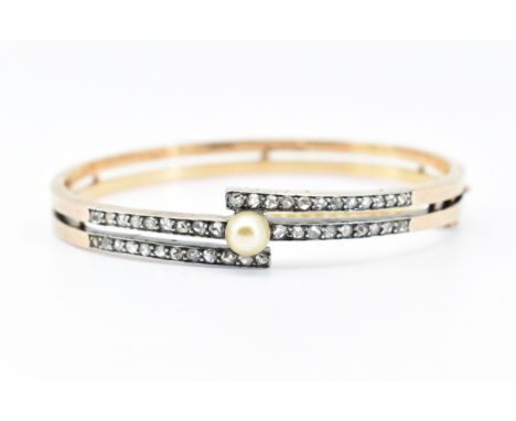 A French 18ct gold Art Deco bangle bracelet having a split band set with rose cut diamonds with a cream tone pearl set to the