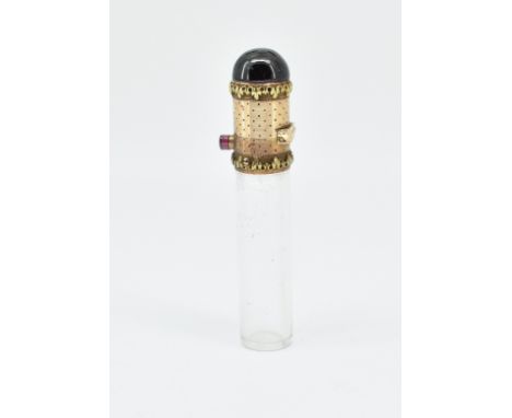 A late 19th Century Victorian scent bottle having a glass cylindrical vile with a gold hinged cap to the top set with a garne