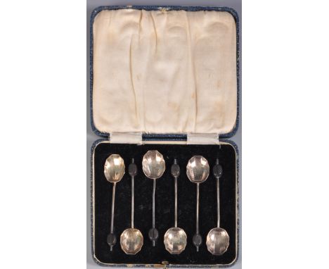 A set of hallmarked silver 1930s Art Deco coffee spoons having ebonised coffee beans to the handles. Hallmarked for Birmingha