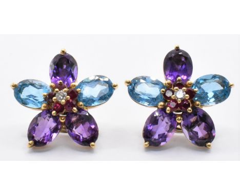 A pair of 18ct gold topaz amethyst&nbsp;diamond floral cluster earrings. The earrings set with five oval cut topaz and amethy