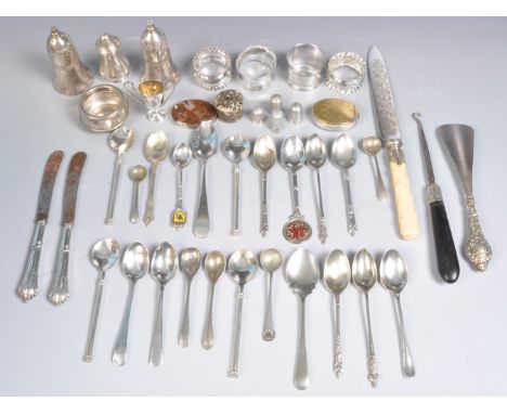 A collection of silver and silver plated items to include a hallmarked silver spoon, hallmarked twin handles cup, hallmarked 