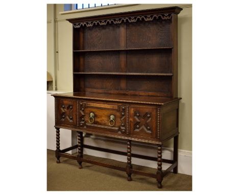 Early 20th Century oak high dresser in the late 17th Century taste, the rack with beaded cornice and scroll pierced frieze ov
