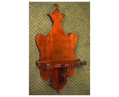 Late 19th/early 20th Century mahogany wall bracket of shaped design, possibly for a clock, 49cm high   Condition: 