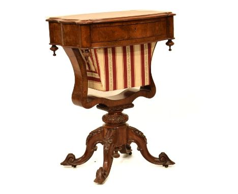Victorian rosewood worktable having a shaped rectangular top, one drawer to the frieze opening to reveal a partitioned interi