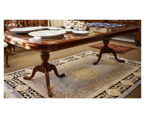 Reproduction mahogany finish seven piece dining suite comprising: rectangular topped extending dining table, fitted two inser