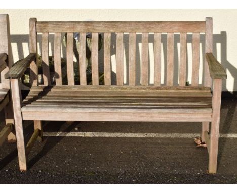 Slatted hardwood garden bench of plain design   Condition: 