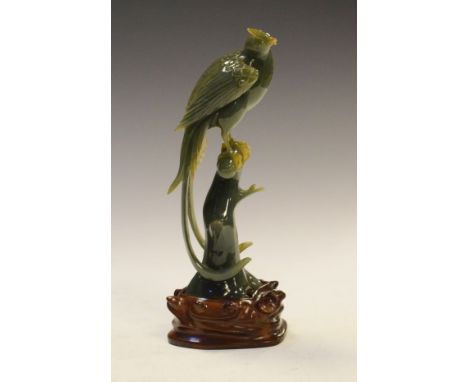 Chinese carved green hardstone figure of a pheasant seated on a tree trunk   Condition: 