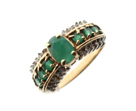 Dress ring set emerald coloured stones with diamond border, size Q, 4.3g approx   Condition: 