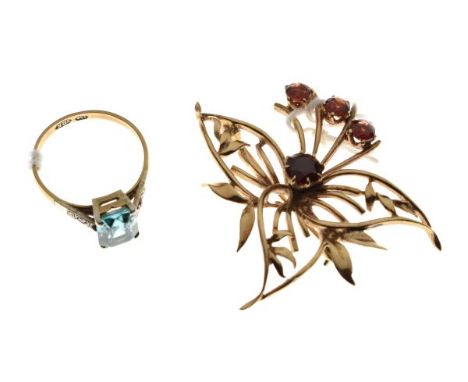 Gold coloured metal flower design brooch set garnet coloured stones, together with a dress ring set rectangular aquamarine co