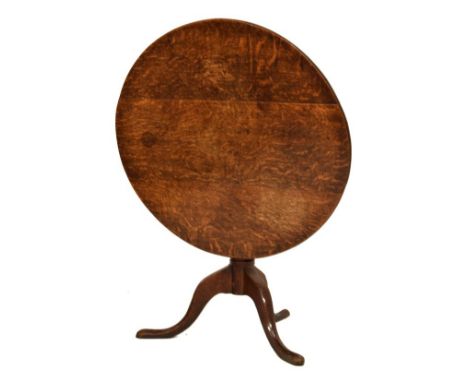 19th Century oak snap-top circular supper table on tripod base, 82cm diameter   Condition: 