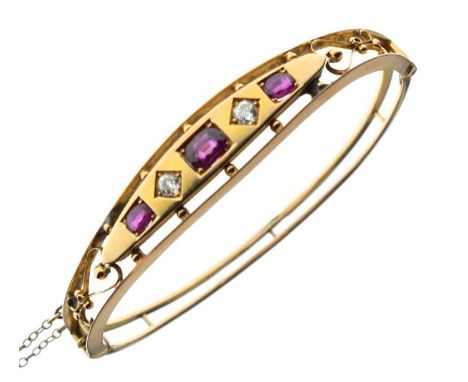 Victorian garnet and diamond set snap bangle, 12g approx   Condition: 
