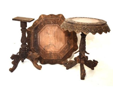 Late 19th/early 20th Century Indian carved hardwood occasional table, the circular top with carved border over pierced wavy a