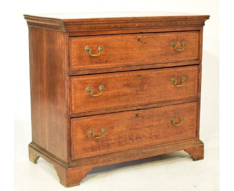 George III oak chest of three long drawers, the top and drawers each having satinwood banding, brass swan neck handles and st